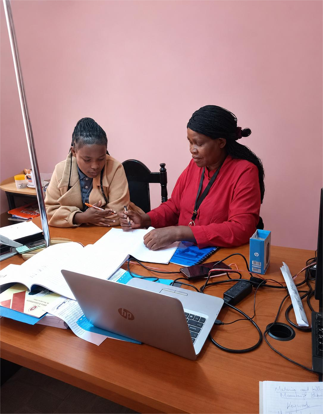 One-on-one mentorship session reviewing project documents